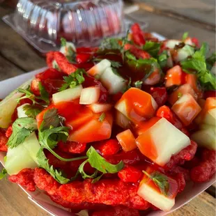 Crazy Cheetos (Hot Cheetos topped with Cucumber, Cilantro, and Chamoy)