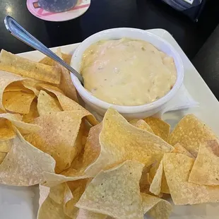 Chips and queso with meat