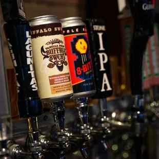 a row of beer taps