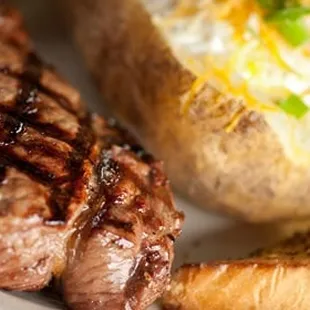 grilled steak and baked potatoes