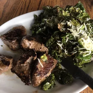 Steak tips and Brussels sprouts leaves