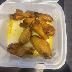 chicken wings in a styrofoam container