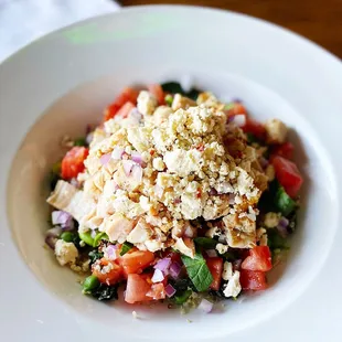 a white bowl filled with a salad