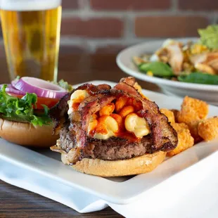 a plate of food and a glass of beer