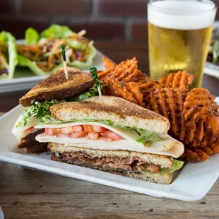 a sandwich and sweet potato fries