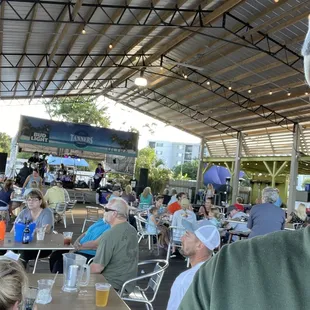 Outdoor tiki seating.  Live music