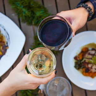 a person holding a glass of wine