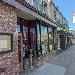 a brick building with a sign on it