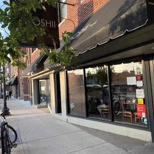 a bicycle parked in front of a store