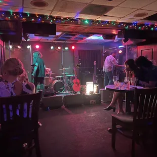 a band performing in a dimly lit room