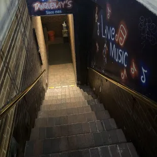 a stairway leading to a bar