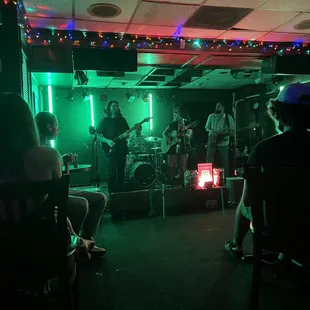 a band playing in a dimly lit room
