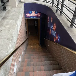 a man walking down a set of stairs