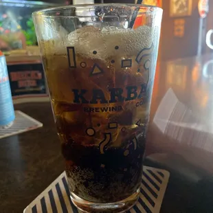a cold drink in a tall glass