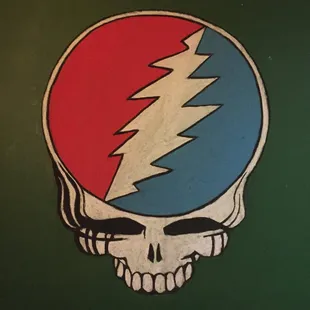 a skull with a red, white and blue grateful grateful logo