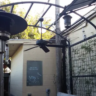 a patio area with a gas heater