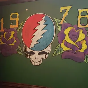 a mural of a skull and flowers
