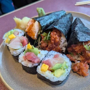 Tropical roll, lobster hand roll, and two spicy tuna hand rolls