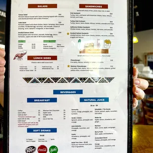 a person holding a menu