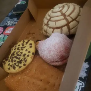 a variety of pastries in a box
