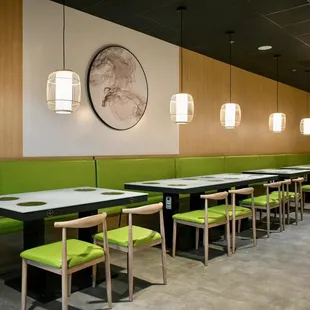 a restaurant with green booths