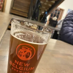 a glass of beer on a table