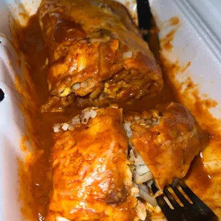 Sausage breakfast burrito smothered in red