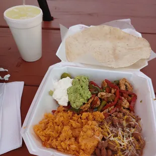 Chicken fajita plate with pico de gallo, guac and sour cream.