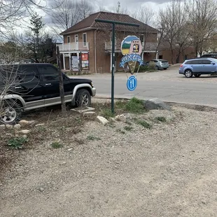 a pickup truck parked at a stop sign
