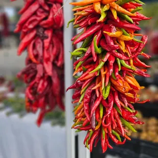 chilis hanging from hooks