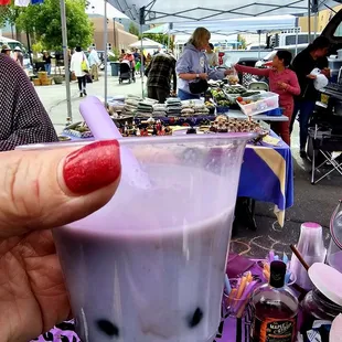 a person holding a drink