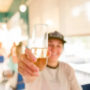 a woman holding a glass of wine