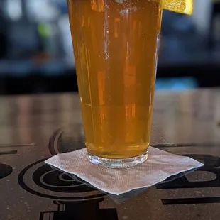 a glass of beer on a table
