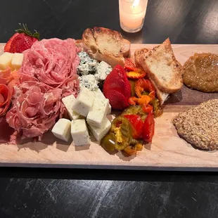 a platter of meat and cheeses