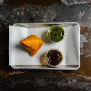 a plate of food with sauces