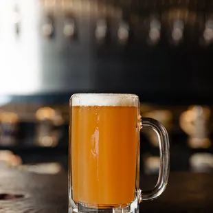 a glass of beer on a table