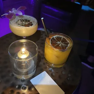 three cocktails on a table