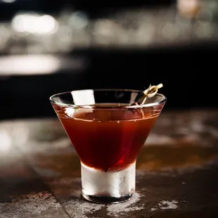 a cocktail in a martini glass