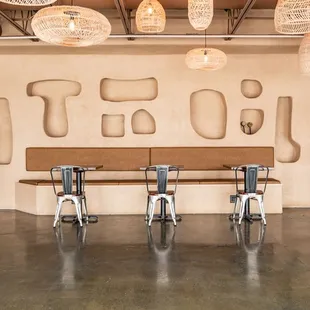 a restaurant with a long table and chairs