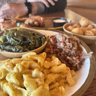 Macaroni &amp; cheese, brisket, collard greens, and hush puppies