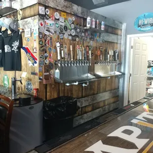 a bar with beer taps on the wall