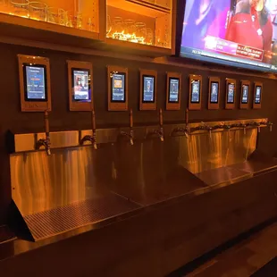 You tap the bracelet that you get then pour yourself your drink.