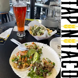 a plate of food and a glass of beer