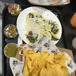 a tray of tacos and chips