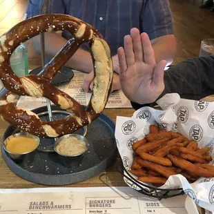 GIANT pretzel appetizer, it's HUGE and sweet potato fries side dish.