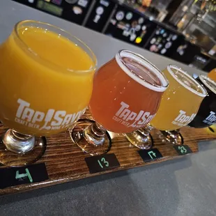 Flight of varying beers. The blood orange was nice.