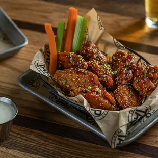  tray of chicken wings with carrots and celery