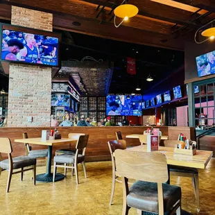 It's a big open space with lots of TVs and a wall of windows.  Looks like they also have outside tables.