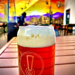 a pint of beer on a table