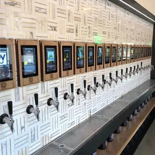 a row of taps on a wall